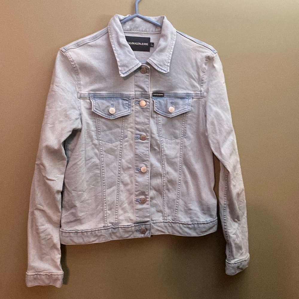 Calvin light blue jean jacket with silver buttons.